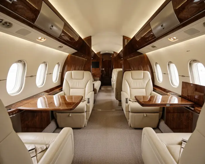 Clean private jet cabin interior with leather seating